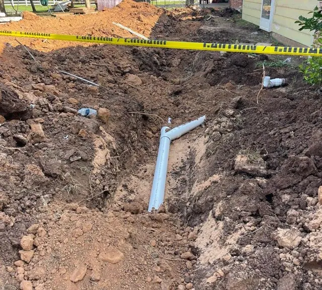 Open trench with new drain pipe