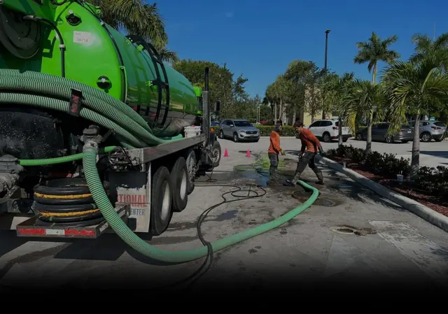 Vacuum truck pumping a commercial tank
