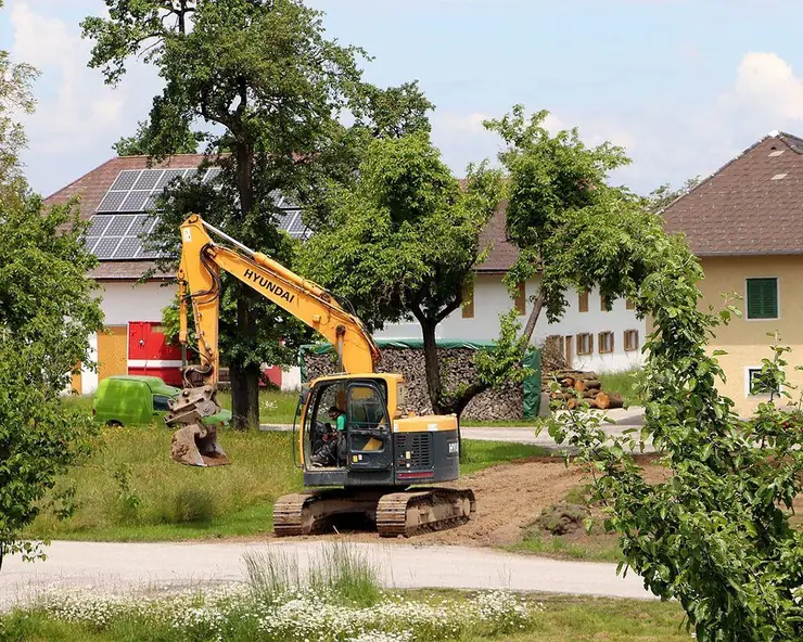 Excavator working in a residential yard