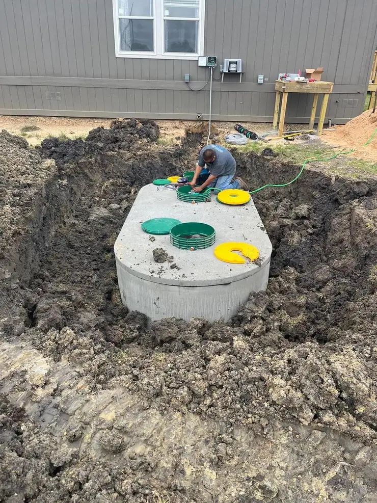 Septic tank with risers and green lids